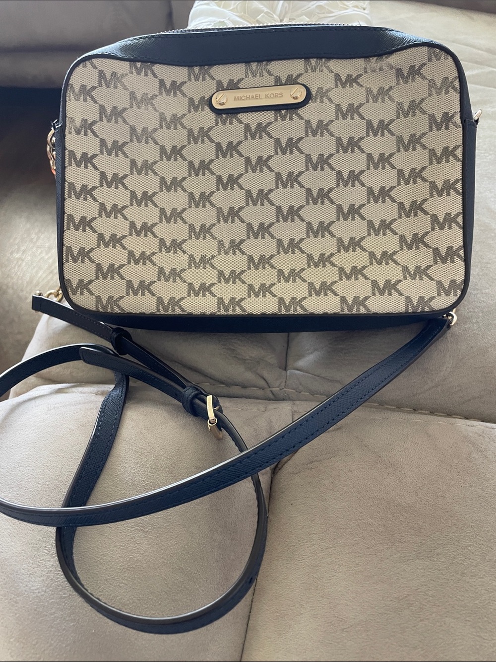 Michael Kors beige canvas and black leather crossbody bag